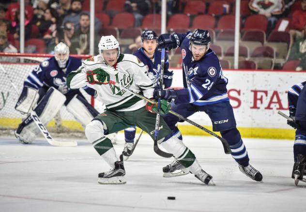 Iowa Wild Jockey for the Puck vs. the Manitoba Moose