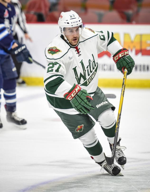 Iowa Wild F Alex Petan Eyes the Puck vs. the Manitoba Moose