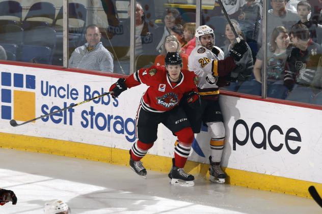 Chicago Wolves D Hubert Labrie Pinned against the Boards vs. the Rockford IceHogs