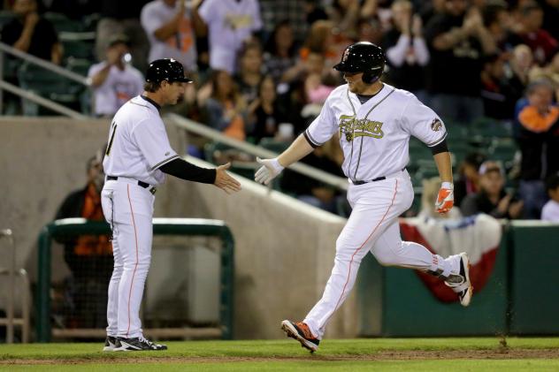 A.J. Reed of the Fresno Grizzlies Crosses the Plate
