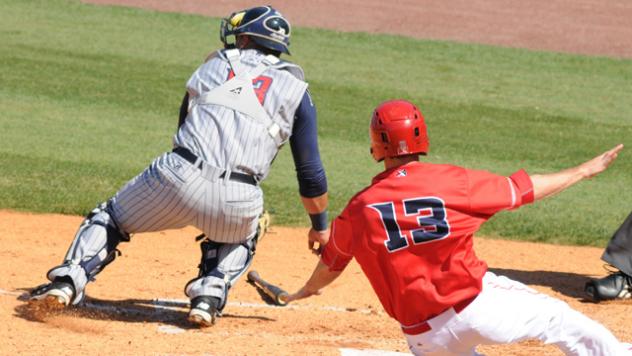 Steve Selsky Comes in to Score for the Louisville Bats against the Toledo Mud Hens