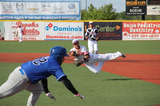 Daniel Fraga of the Florence Freedom Makes a Diving Throw to First