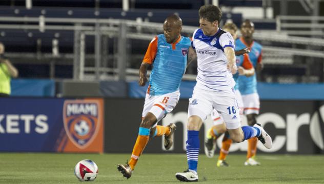FC Edmonton Battles for the Ball vs. Miami FC