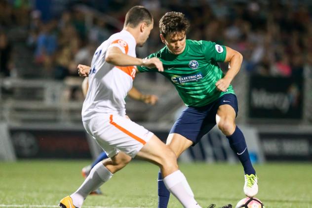 Orange County SC Midfielder Mats Bjurman Battles for the Ball