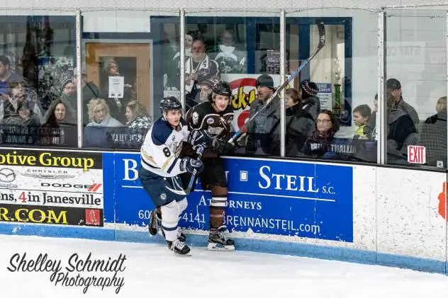 Janesville Jets Forward Brenden MacLaren against the Boards