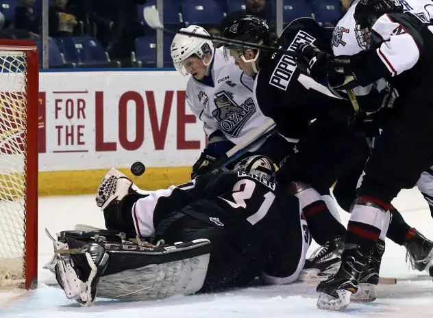 Vancouver Giants and Victoria Royals Scramble in Front of the Vancouver Net