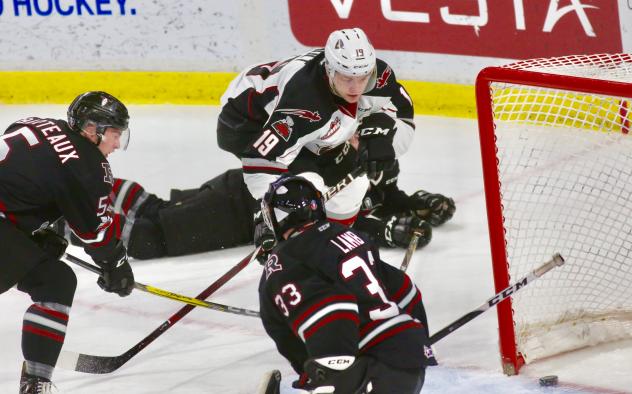 Dawson Holt of the Vancouver Giants scores against the Red Deer Rebels