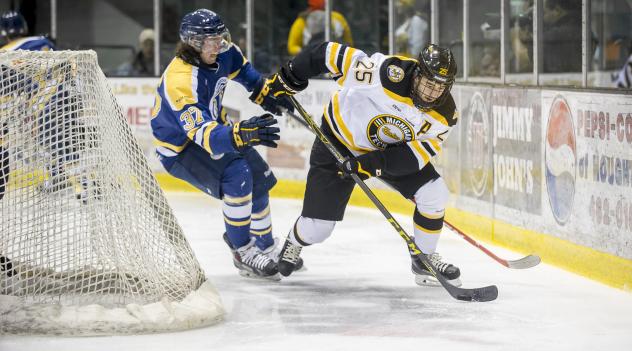 Forward Michael Neville with Michigan Tech