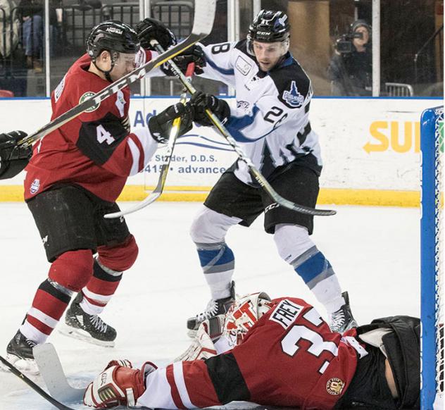 Idaho Steelheads fight for the puck in front of the Rapid City Rush net