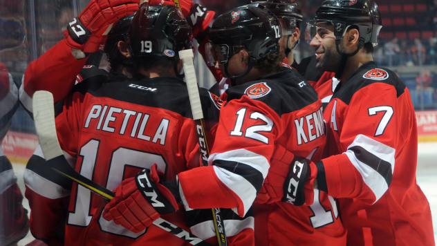 Binghamton Devils congratulate Nick Lappin on his goal