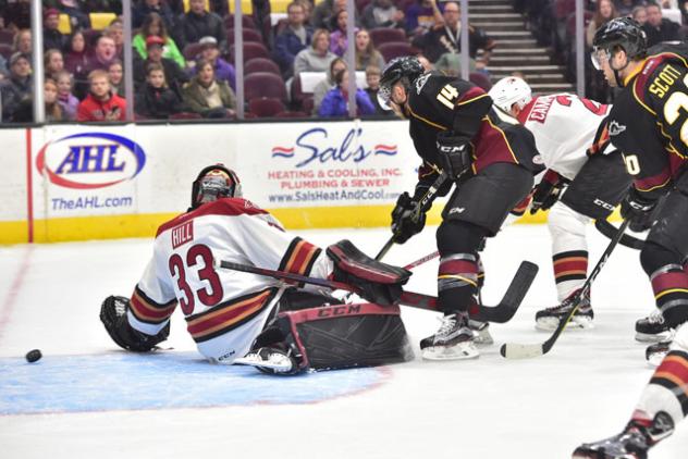 The Tucson Roadrunners sneak a goal past the Cleveland Monsters Goaltender Adin Hill