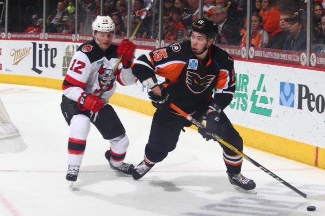 Lehigh Valley Phantoms Forward Mikhail Vorobyev controls the puck against the Binghamton Devils