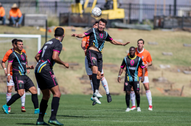 Las Vegas Lights FC Midfielder Carlos Alvarez battles Orange County SC for possession