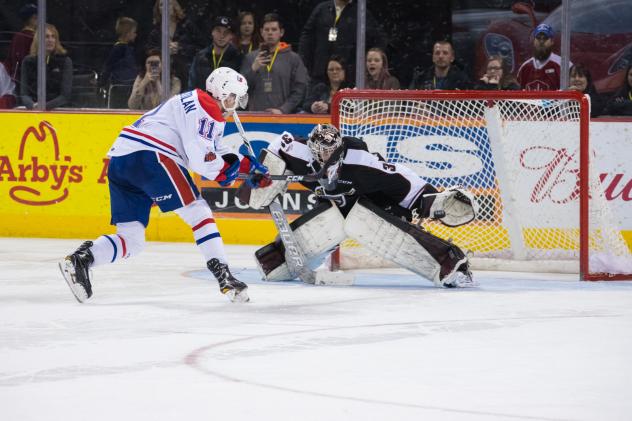 Vancouver Giants Goaltender Trent Miner makes a glove save against the Spokane Chiefs
