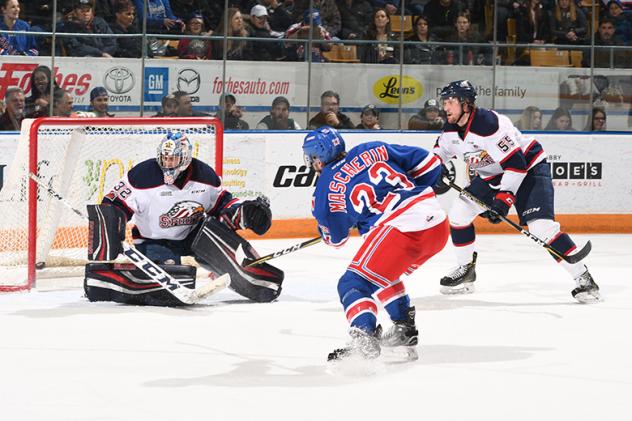 Adam Mascherin of the Kitchener Rangers scores against the Saginaw Spirit