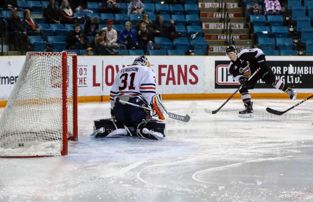 Ty Ronning of the Vancouver Giants Earn scores against Kamloops Blazers Goaltender Dylan Ferguson