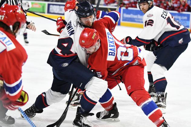 Kevin Irwin of the Macon Mayhem battles Cam Bakker of the Roanoke Rail Yard Dawgs