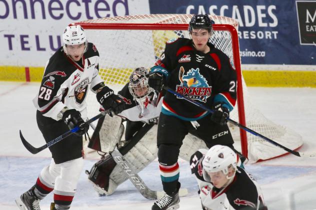 Darian Skeoch of the Vancouver Giants battles the Kelowna Rockets