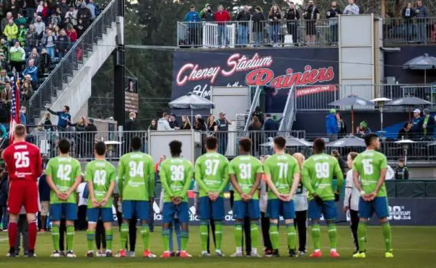 S2 players standing for the anthem before last Friday's inaugural match at Cheney Stadium