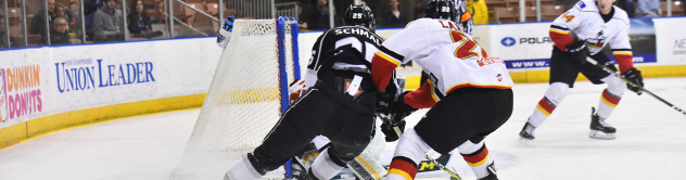 Matt Schmalz of the Manchester Monarchs battles the Adirondack Thunder