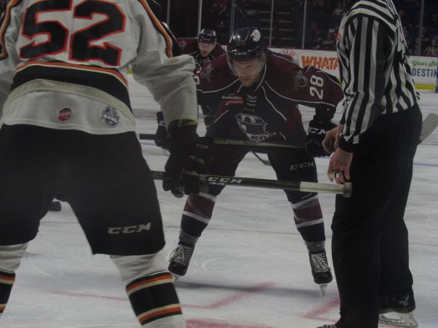 Ryan Tesink of the Tulsa Oilers faces off against the Quad City Mallards