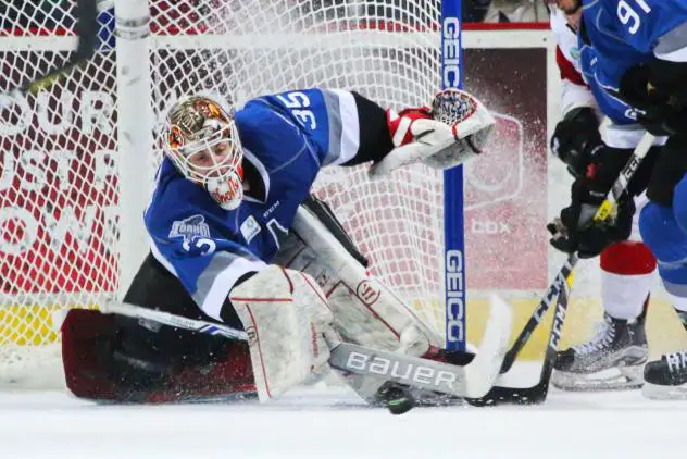 Idaho Steelheads Goaltender Tomas Sholl tips away a shot