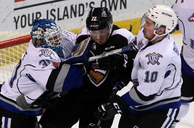Victoria Royals Goaltender Griffen Outhouse battles the Vancouver Giants