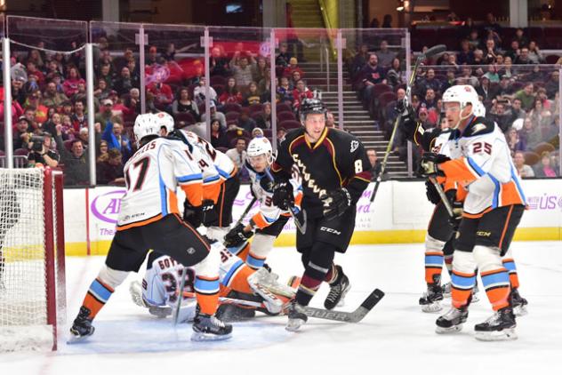 Cleveland Monsters Left Wing Kale Kessy in front of the San Diego Gulls' net