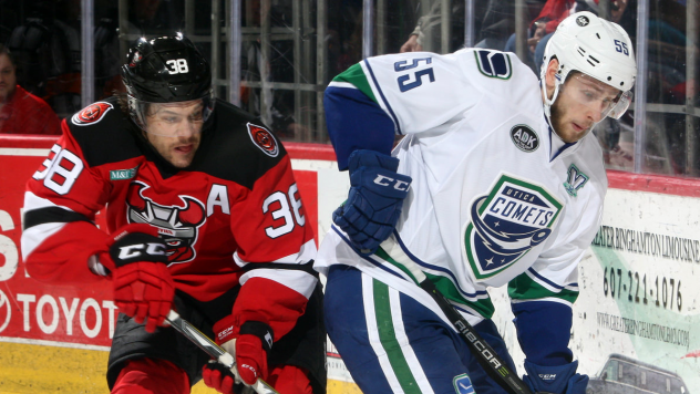 Binghamton Devils Center Bracken Kearns vs. Utica Comets Defender Guillaume Brisebois