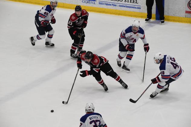 Chicago Steel control the puck vs. Team USA