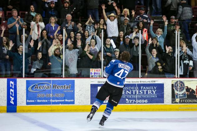 Idaho Steelheads Forward Connor Chatham tosses T-shirts to the home crowd