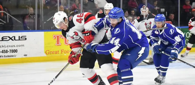 Binghamton Devils Right Win Michael Latta takes on the Syracuse Crunch