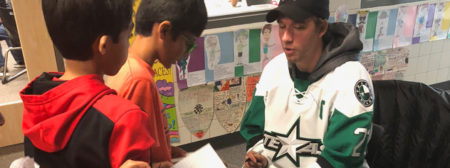 Travis Morin of the Texas Stars signs autographs for young fans