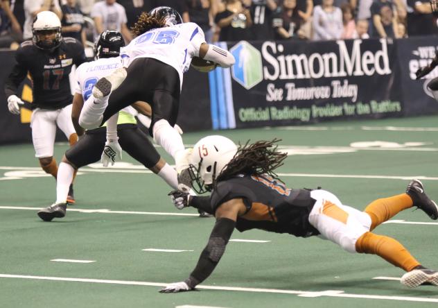 Dillion Winfrey of the Arizona Rattlers dives for a Cedar Rapids Titans ballcarrier