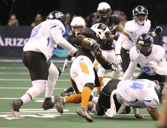 The Arizona Rattlers run the ball against the Cedar Rapids Titans
