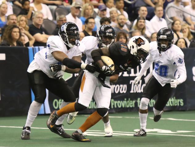 Shadrach Thornton of the Arizona Rattlers powers for yardage vs. the Cedar Rapids Titans