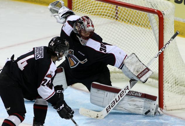 Vancouver Giants Goaltender David Tendeck tips away a Victoria Royals' shot attempt