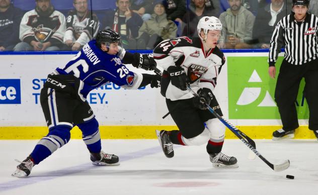 Bowen Byram of the Vancouver Giants skates through the Victoria Royals