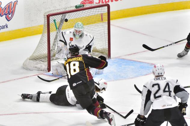 Ryan Kujawinski of the Cleveland Monsters scores against the San Antonio Rampage