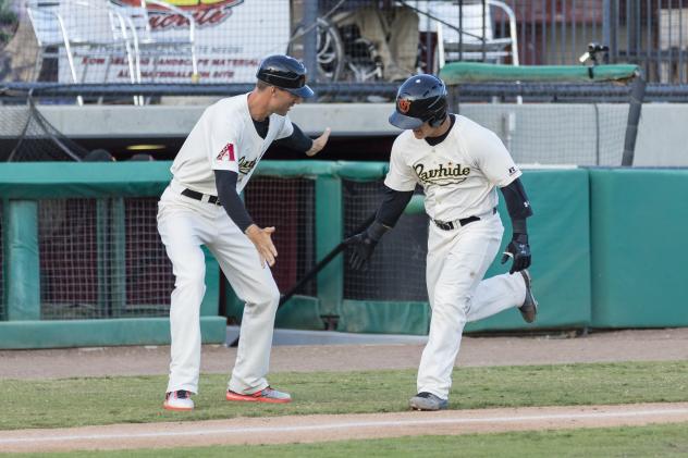 Daulton Varsho of the Visalia Rawhide is congratulated on his second-inning home run