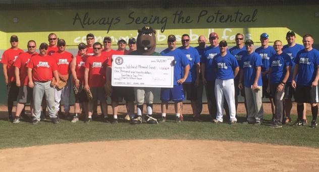 Police vs. Fire Softball Game teams at Athletic Park