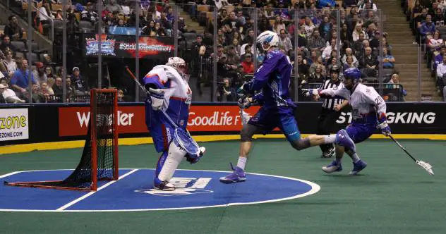 Paul Dawson of the Rochester Knighthawks moves in on the Toronto Rock goal