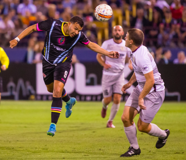 Lights FC Forward Sammy Ochoa heads a ball vs. Sacramento Republic FC