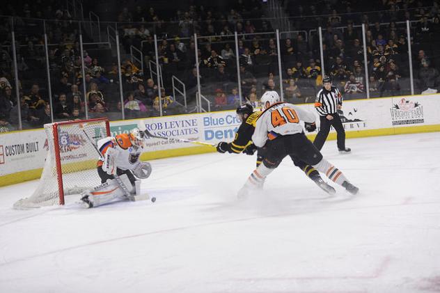 Lehigh Valley Phantoms goaltender Alex Lyon stops a Providence Bruins' shot
