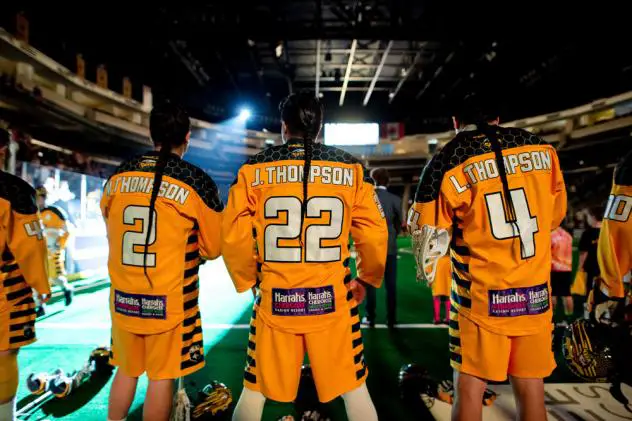 Miles, Jerome and Lyle Thompson of the Georgia Swarm prepare to enter the field