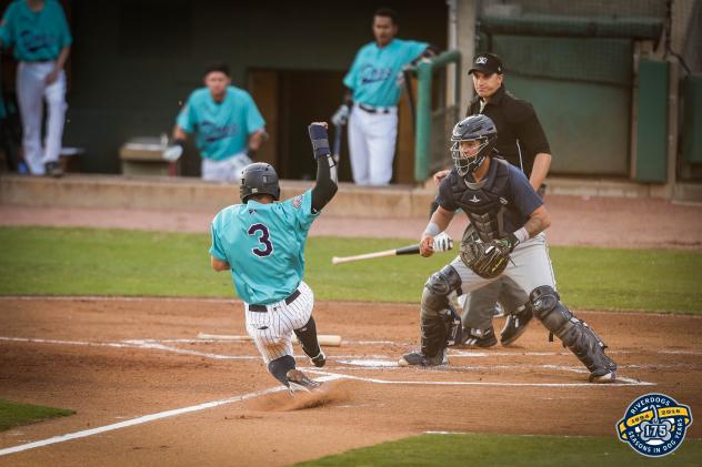 Charleston RiverDogs shortstop Wilkerman Garcia slides home