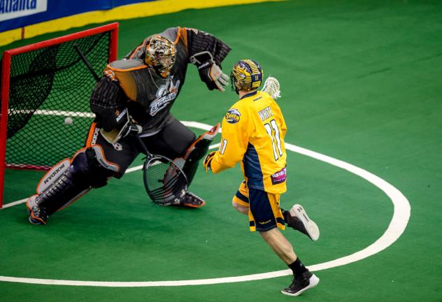 Joel White of the Georgia Swarm shoots past the New England Black Wolves goaltender