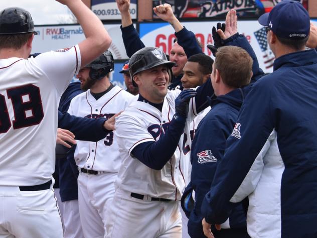 Scott Kelly receives congratulations from his Somerset Patriots teammates