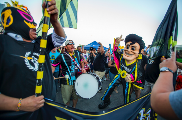 Las Vegas Lights FC mascot Cash the Soccer Rocker mixes with fans
