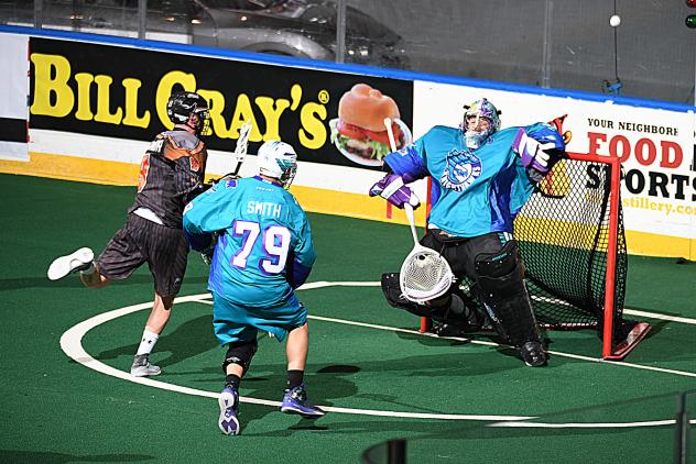 Rochester Knighthawks Goalkeeper Matt Vinc stops a New England Black Wolves' shot